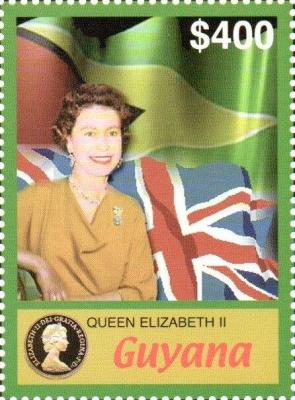 2006. In-Front-of-National-Flags-of-Guyana-and-Great-Britain.jpg