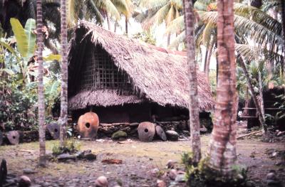 Community_house_of_Yorlap_(Yap_Islands)_with_stone_money_made_in_Palau_NOAA.jpg